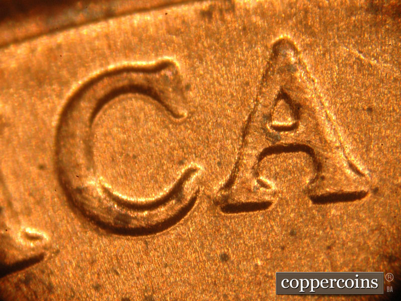 Die-stage C marker on 2018D•1DR•001 showing Slight separation on the lower serifs on the C and A of AMERICA.