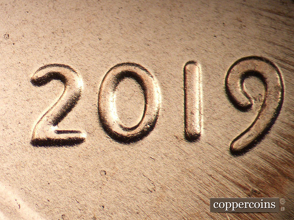Die-stage B marker on 2019P•1DO•001 showing Extra thisckness on date.