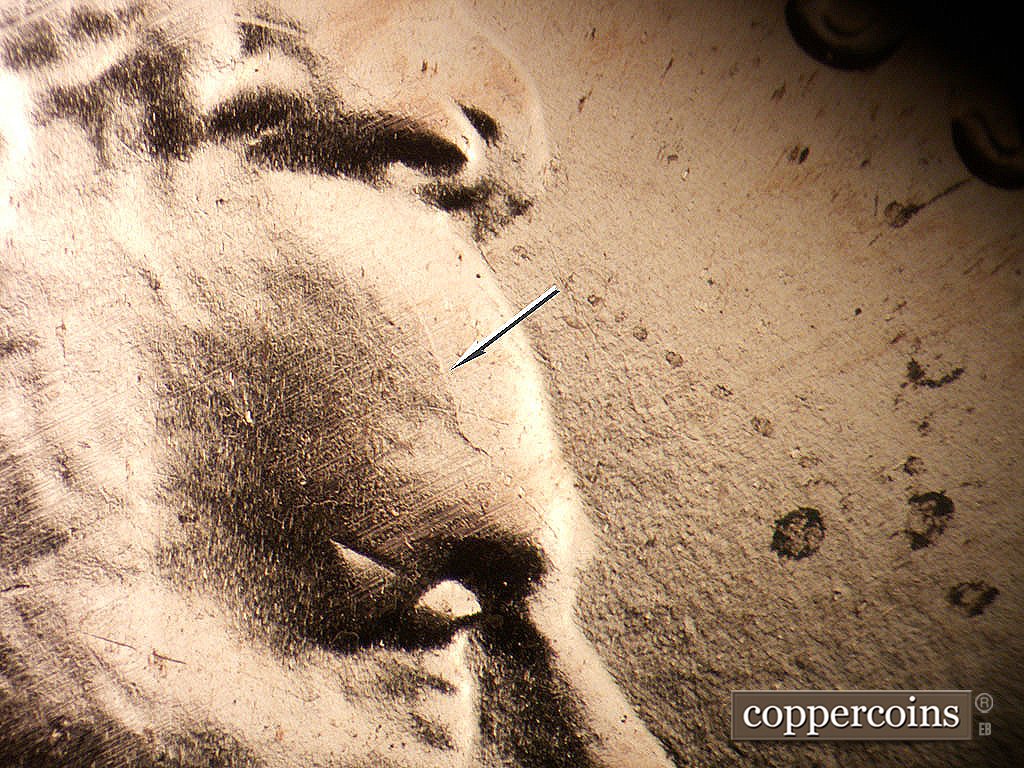 Die-stage B marker on 2019P•1DO•001 showing Die crack on forehead.
