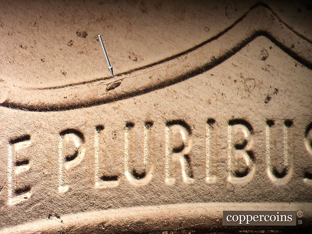 Die-stage B marker on 2019P•1DO•001 showing Die chip and die crack on left side upper shield.