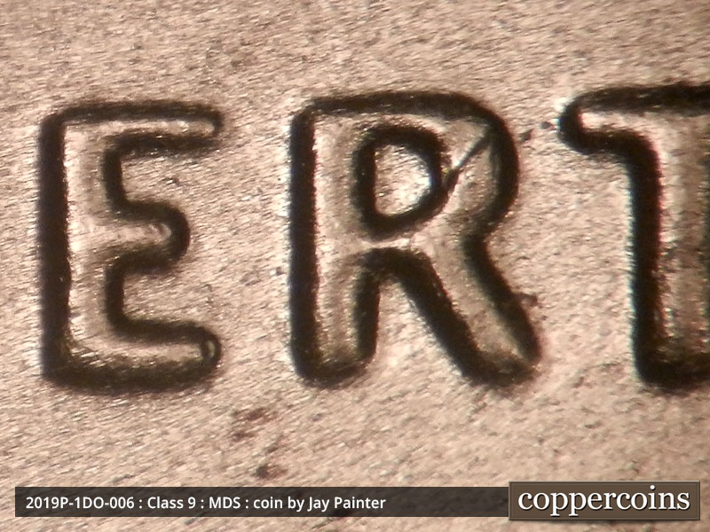 Die-stage B marker on 2019P•1DO•006 showing The spread seen on LIBERTY.