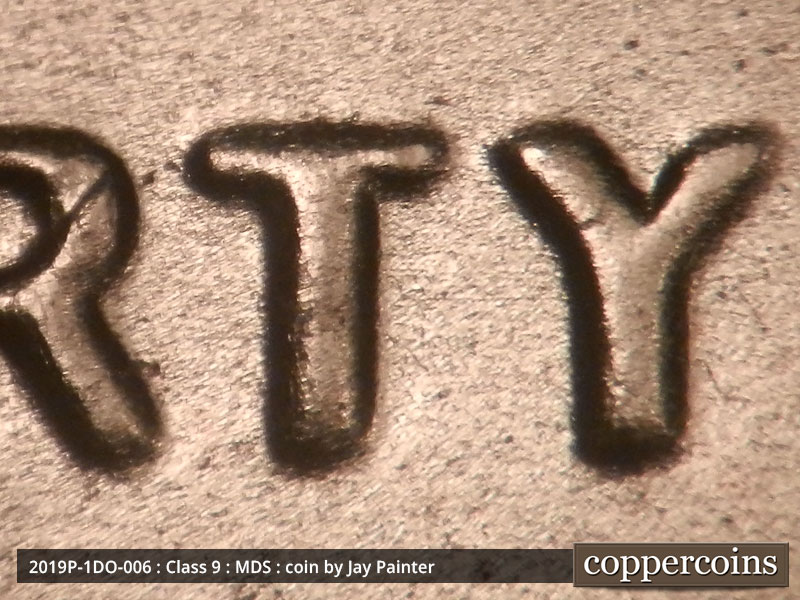 Die-stage B marker on 2019P•1DO•006 showing The spread seen on LIBERTY.