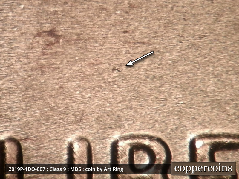 Die-stage B marker on 2019P•1DO•007 showing A die dot above the B.
