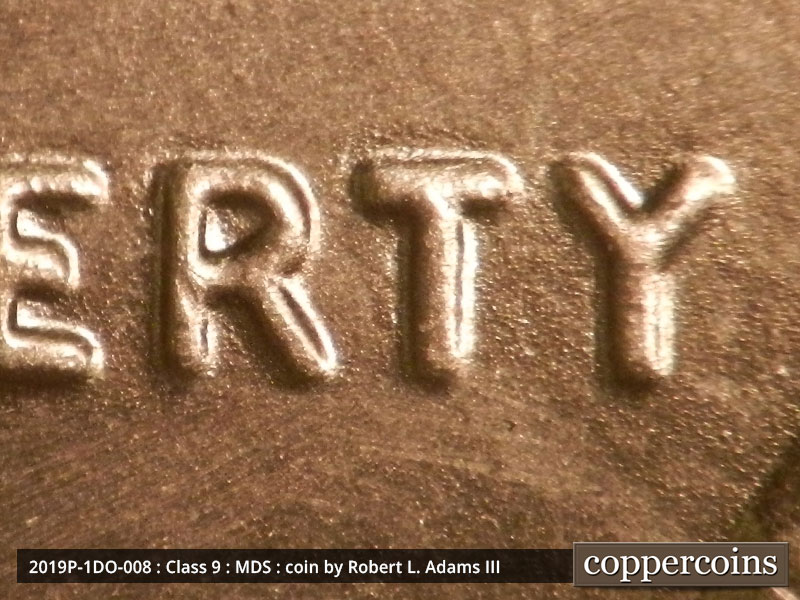 Die-stage B marker on 2019P•1DO•008 showing A moderate spread in LIBERTY.