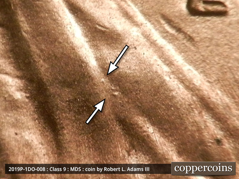 Die-stage B marker on 2019P•1DO•008 showing Three small die dots on Lincoln's jacket.