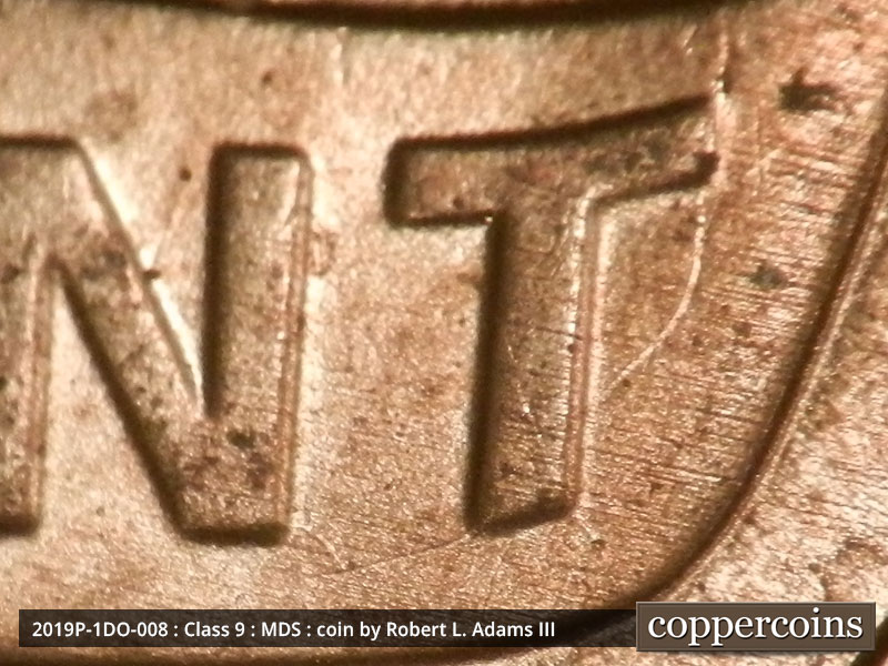 Die-stage B marker on 2019P•1DO•008 showing A die crack runs from the bar of the T to the stem of the T in CENT.