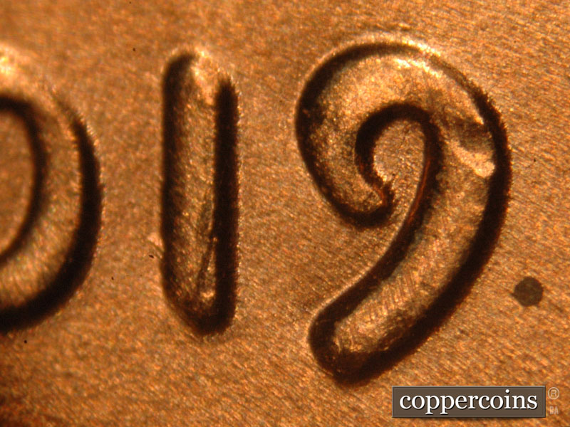 Die-stage A marker on 2019P•1DO•010 showing The doubling can be seen on the 1 and 9 as well.