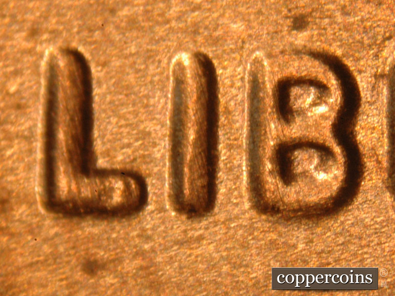 Die-stage A marker on 2019P•1DO•010 showing A spread can be seen on LIBERTY.