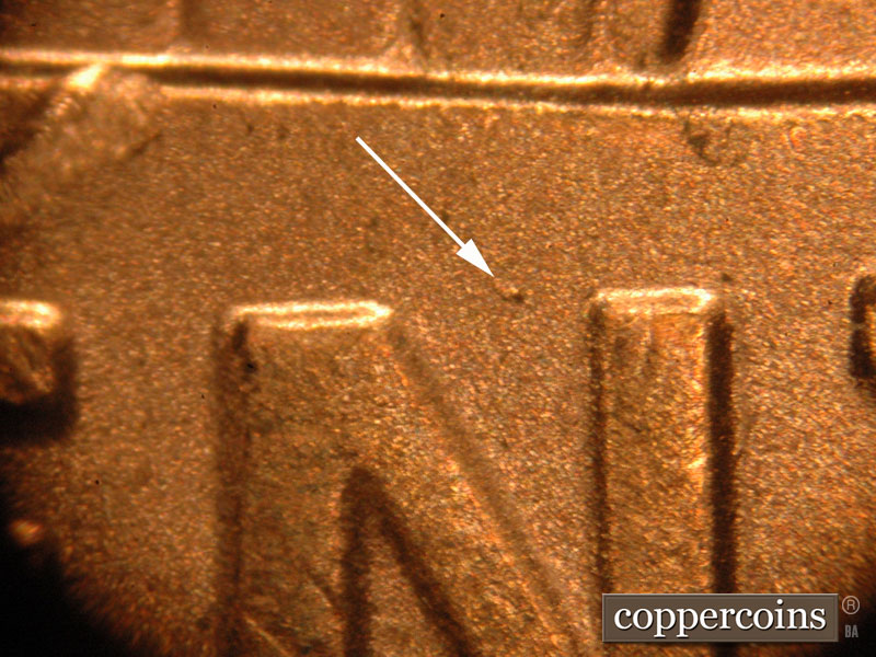 Die-stage A marker on 2019P•1DO•010 showing A die dot on the banner above the N.