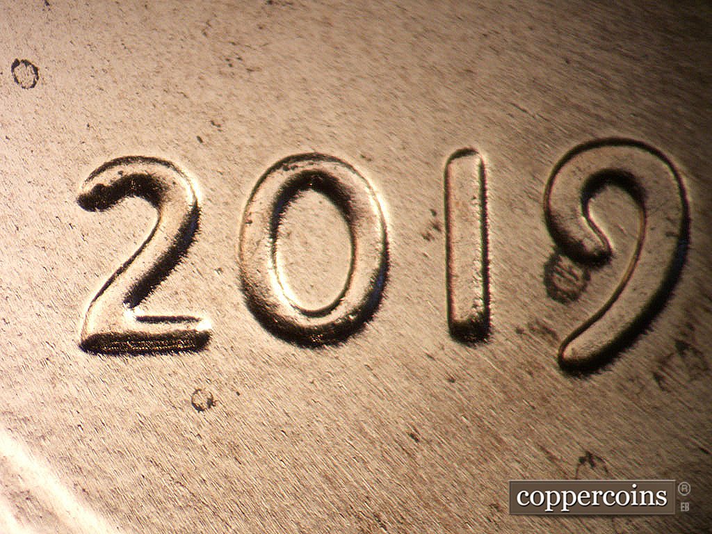 Die-stage C marker on 2019P•1DO•012 showing Moderate extra thickness on 20 in date.