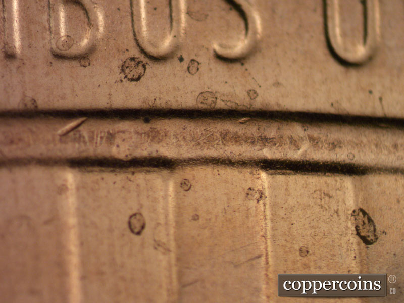 Die-stage B marker on 2020D•1DR•001 showing Separation with extra parts of a crown base to the south of the primary crown base show at the tops of stripes 3, 5,….