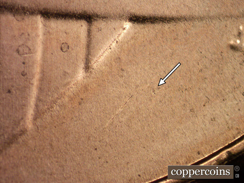 Die-stage B marker on 2020D•1DR•001 showing A heavy die dot shows in the lower right field.
