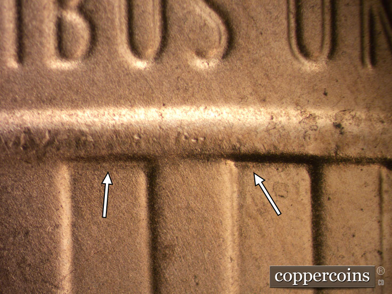 Die-stage B marker on 2020D•1DR•002 showing Light to moderate extra lower border of the shield crown through stripes 5, 7 and 9.
