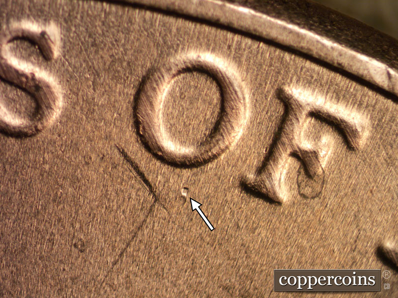 Die-stage B marker on 2020D•1DR•002 showing Die damage mark shows beneath OF.