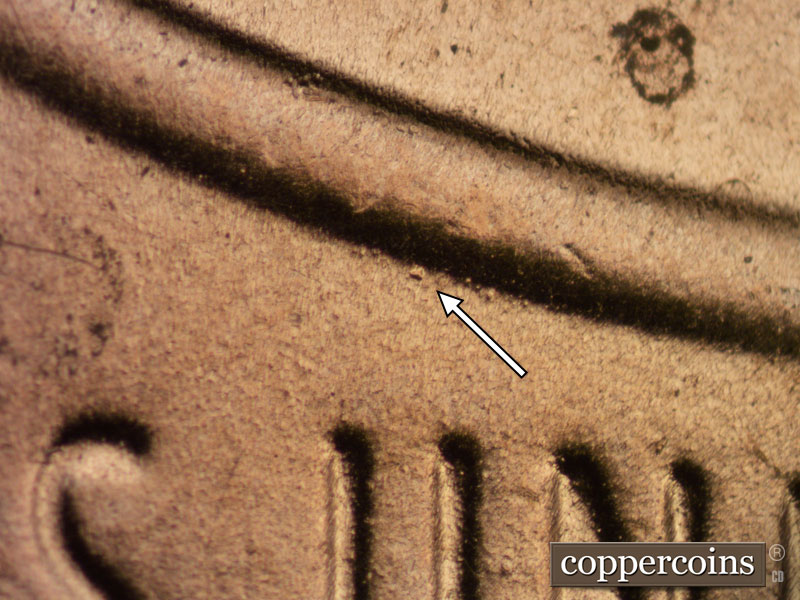 Die-stage B marker on 2020D•1DR•003 showing A heavy die dot shows above the first U of UNUM.