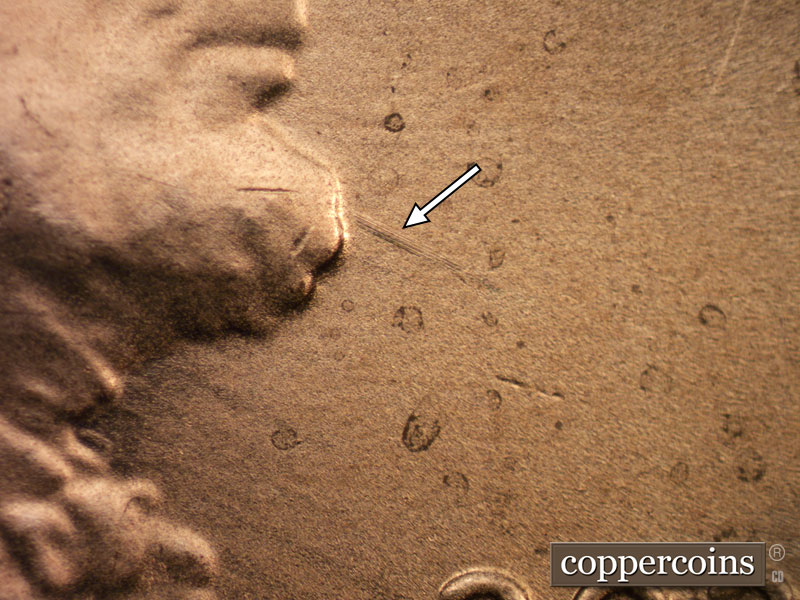 Die-stage B marker on 2020D•1DR•003 showing Linear die damage shows in the throat.