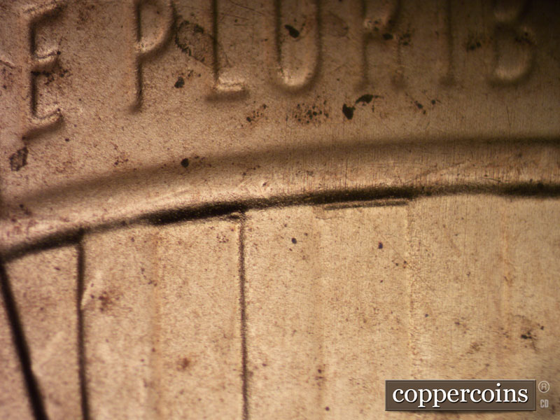 2020 Lincoln cent obverse, CopperCoins die 2020D•1DR•004 — Doubling shows on the bottom of the crown border of the shield in stripes 3 and 5.