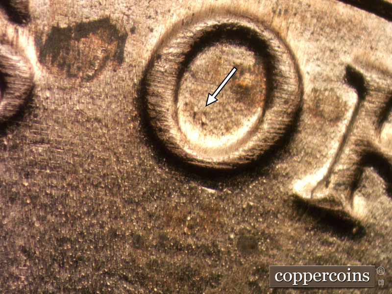 Die-stage B marker on 2020D•1DR•004 showing Two die dots inside the O of OF.