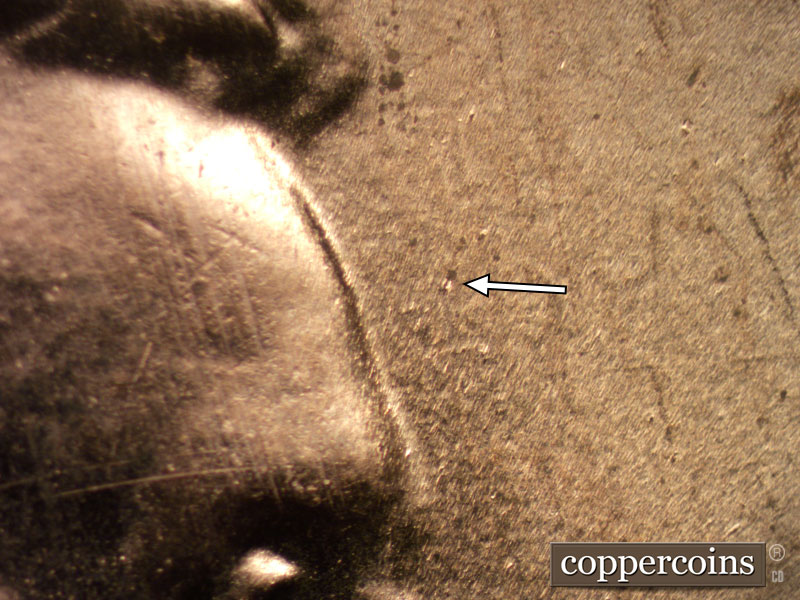 Die-stage B marker on 2020D•1DR•004 showing Die dots show in front of the forehead.