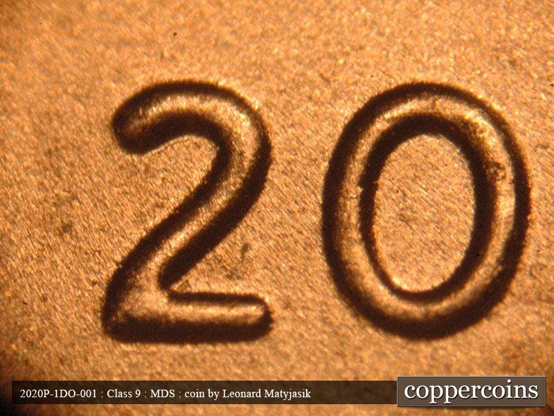 Die-stage B marker on 2020P•1DO•001 showing Slight extra thickness on date.