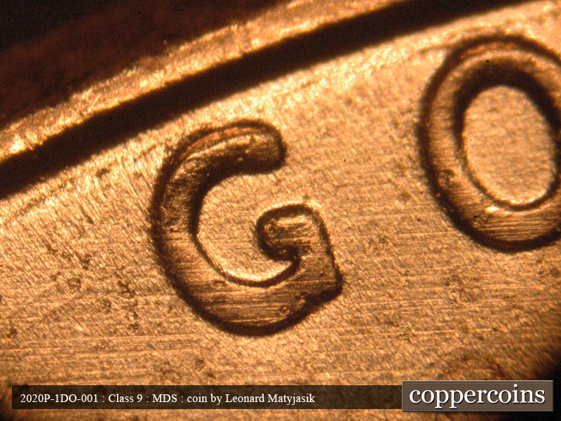 Die-stage B marker on 2020P•1DO•001 showing Moderate thickness shows in G of GOD.
