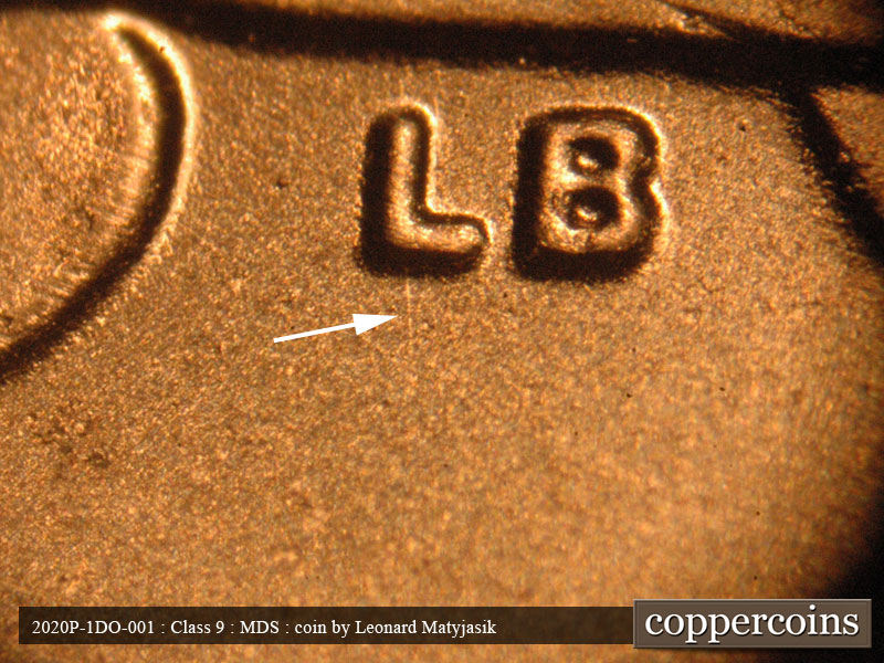 Die-stage B marker on 2020P•1DO•001 showing Short North-South die scratch of L of LB.