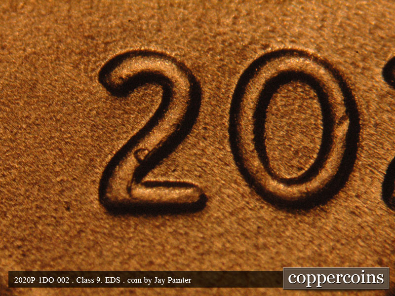 Die-stage C marker on 2020P•1DO•002 showing Mild doubling of DATE, Die break on first 2 in date just starting to form.