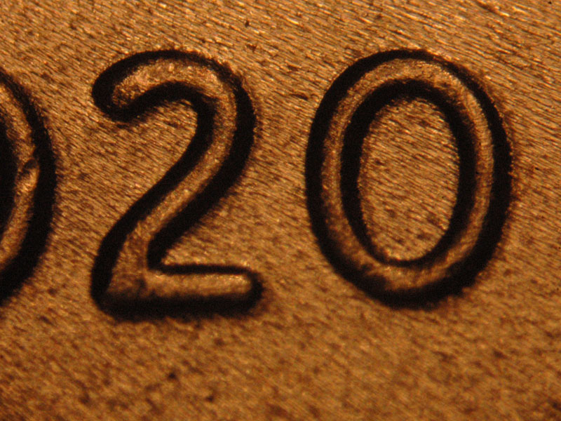 Die-stage C marker on 2020P•1DO•002 showing A very slight spread is seen on the second 2 in the date.