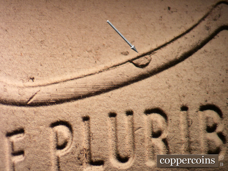 Die-stage B marker on 2020P•1DO•004 showing Die break on shield rim above R in PLURIBUS.