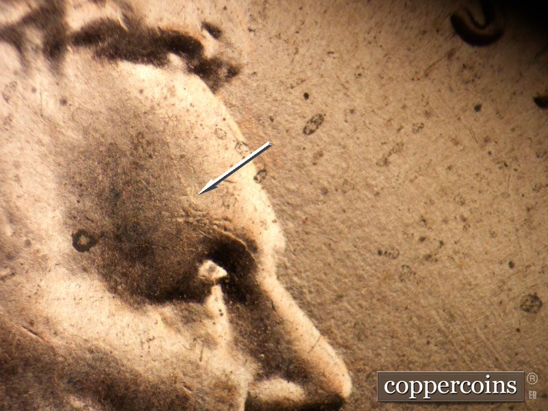 Die-stage B marker on 2021P•1DO•004 showing Die crack on forehead.