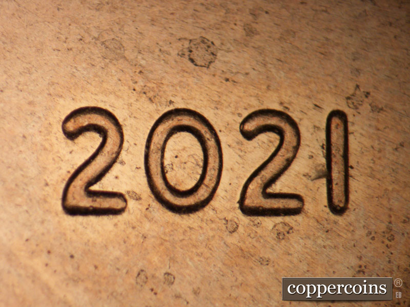 Die-stage A marker on 2021P•1DO•006 showing Light extra thickness on 20 in date.