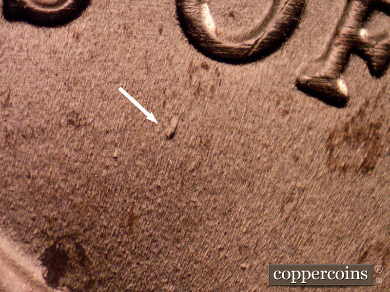 Die-stage B marker on 2022D•1DR•001 showing Die dot below O in OF.