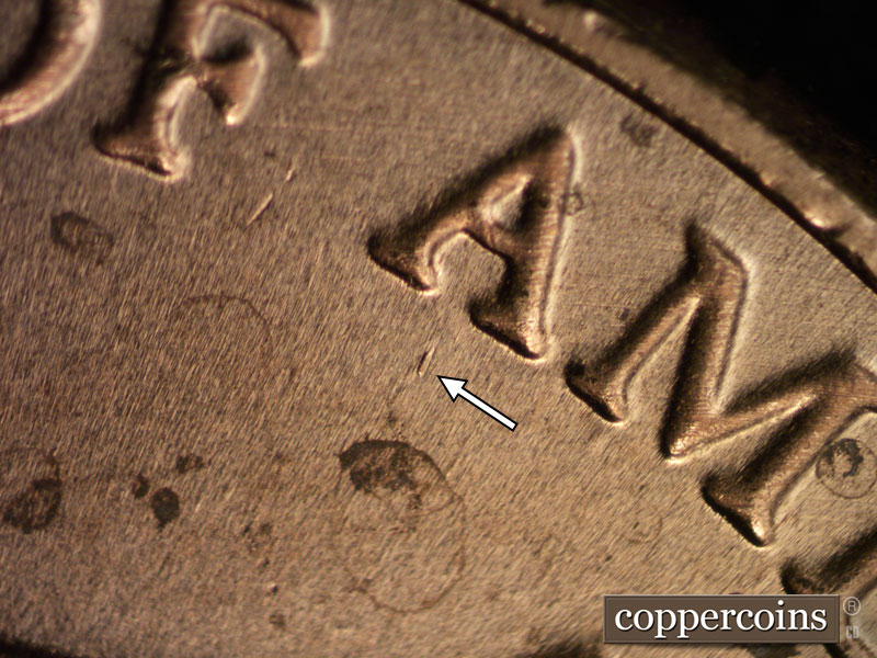 Die-stage B marker on 2023D•1DR•001 showing Die dot below first A in AMERICA.