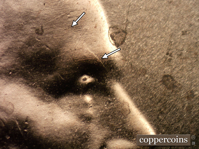 Die-stage B marker on 2023D•1DR•001 showing Die crack on forehead.