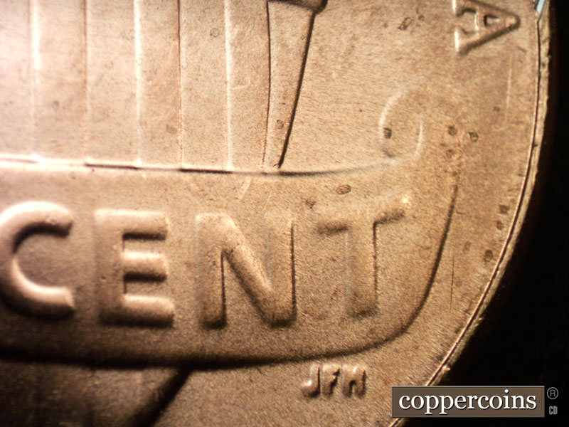Die-stage C marker on 2023D•1DR•002 showing SHort die crack above N in CENT.
