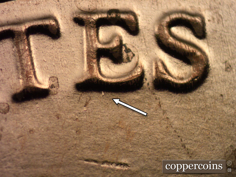 Die-stage B marker on 2024D•1DO•001 showing Die dot on bottom of E in STATES.