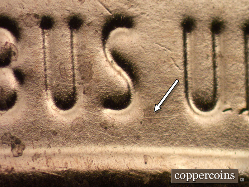 Die-stage B marker on 2024D•1DO•001 showing Light die scratches show around the S of PLURIBUS. Die chip near U in UNUM.