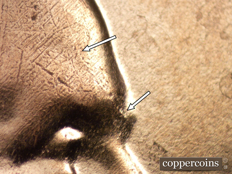 Die-stage B marker on 2024D•1DO•002 showing Die crack on forehead.