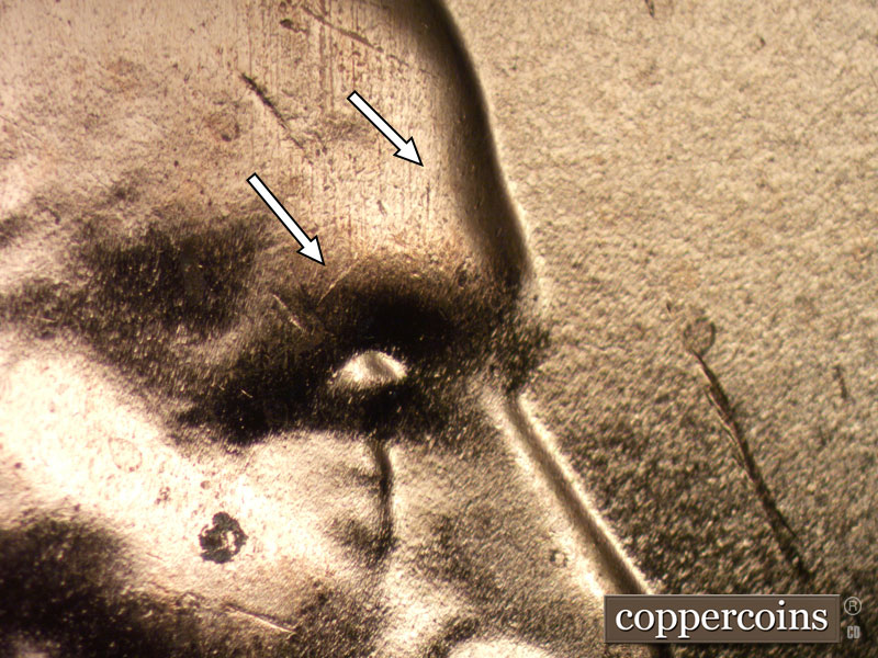 Die-stage B marker on 2024D•1DR•001 showing Die crack on forehead.