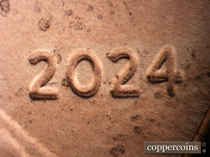 Die-stage C marker on 2024P•1DO•001 showing Nice doubling on date.