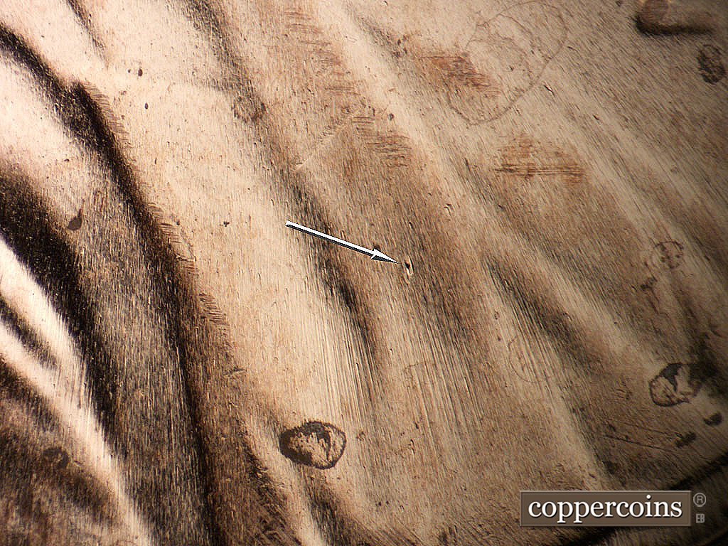 Die-stage B marker on 2024P•1DR•001 showing Die dot on lapel.