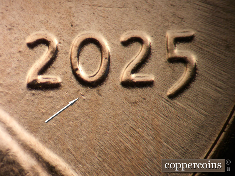 Die-stage B marker on 2025P•1DO•001 showing Small die gouge under 0 in date.