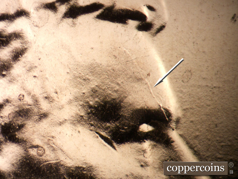 Die-stage B marker on 2025P•1DO•001 showing Die crack on forehead.