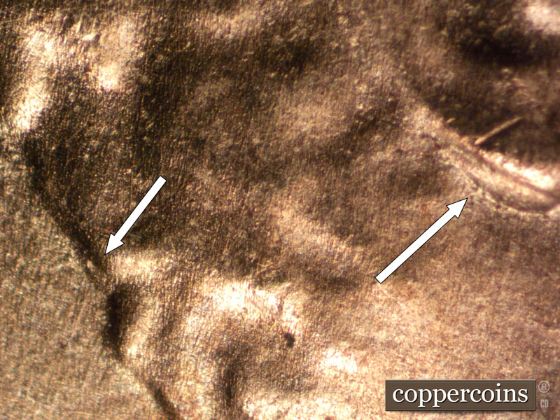 Die-stage B marker on 2025P•1DO•002 showing Doubling seen on earlobe and back of hair.
