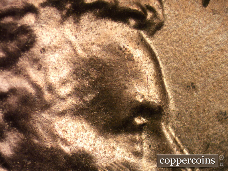 Die-stage B marker on 2025P•1DO•002 showing Die crack on forehead.